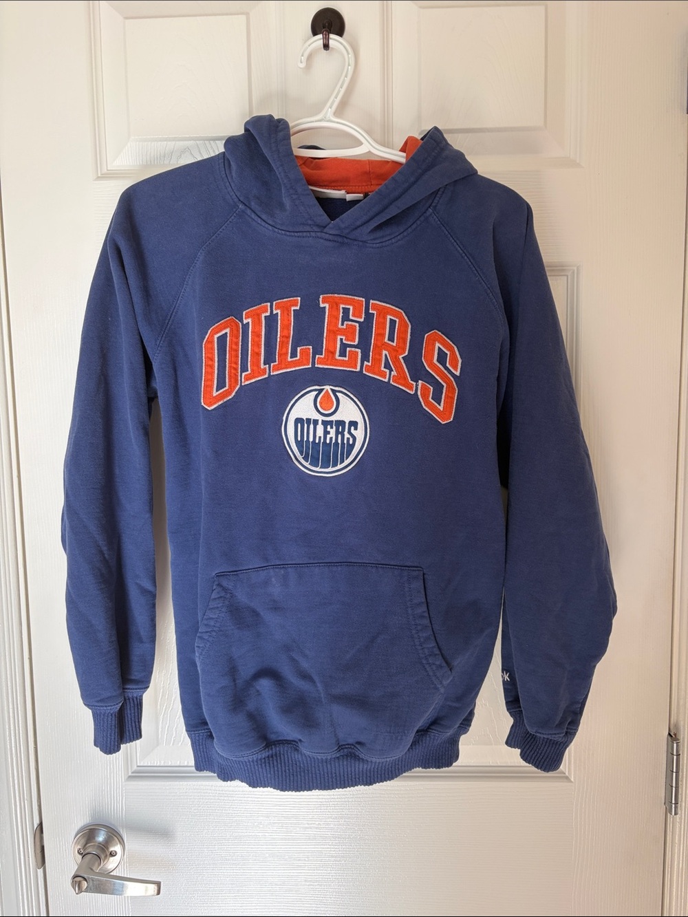 Reebok Youth Oilers Royal Blue Hoodie with Orange and White Logo